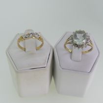 A small three stone diamond Ring, mounted in 9ct yellow and white gold, Size O½, in heart shaped