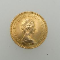 An Elizabeth II gold Sovereign, dated 1974.