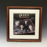 A signed Queen 'Greatest Hits' Album Cover, by all four band members Freddie Mercury, Brian May,