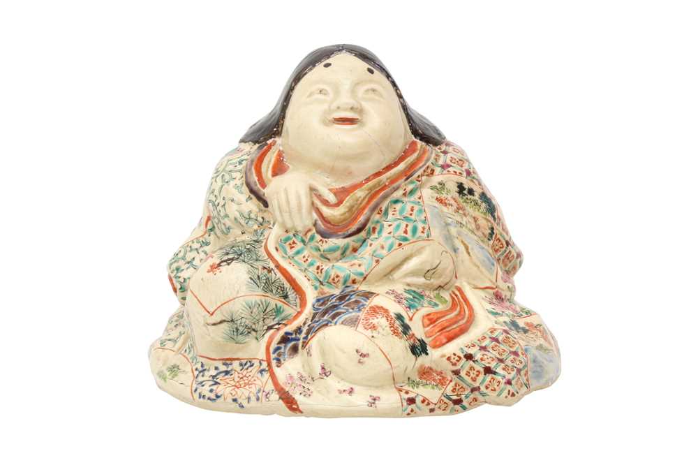 A JAPANESE SATSUMA FIGURE OF OKAME