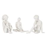 THREE WHITE BISQUIT PORCELAIN FIGURES OF SEATED FEMALE NUDES