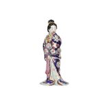 A 19TH CENTURY JAPANESE KUTANI PORCELAIN EROTIC FIGURE OF A GEISHA