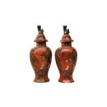 A PAIR OF RED-GROUND BALUSTER VASES AND COVERS