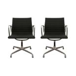 A PAIR OF EAMES EA108 OFFICE SWIVEL CHAIRS BY VITRA
