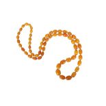 A BUTTERSCOTCH AMBER BEAD NECKLACE