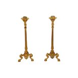 A PAIR OF 19TH CENTURY LOUIS XV BRASS CANDLESTICKS