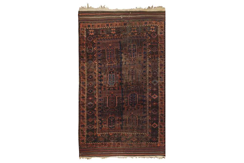 AN ANTIQUE BALOUCH RUG, NORTH-EAST PERSIA