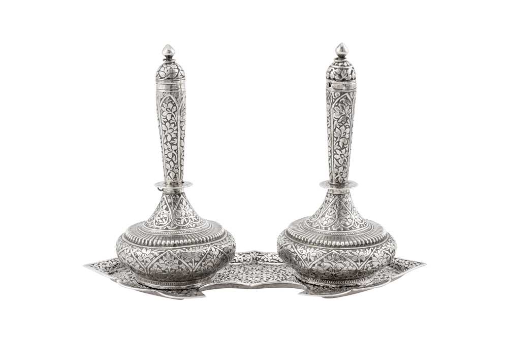 A pair of late 19th / early 20th century Anglo – Indian unmarked silver bottles (surhai), Kashmir ci