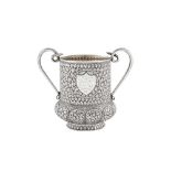 A late 19th century Anglo – Indian unmarked silver twin handled cup, Kashmir dated 1886