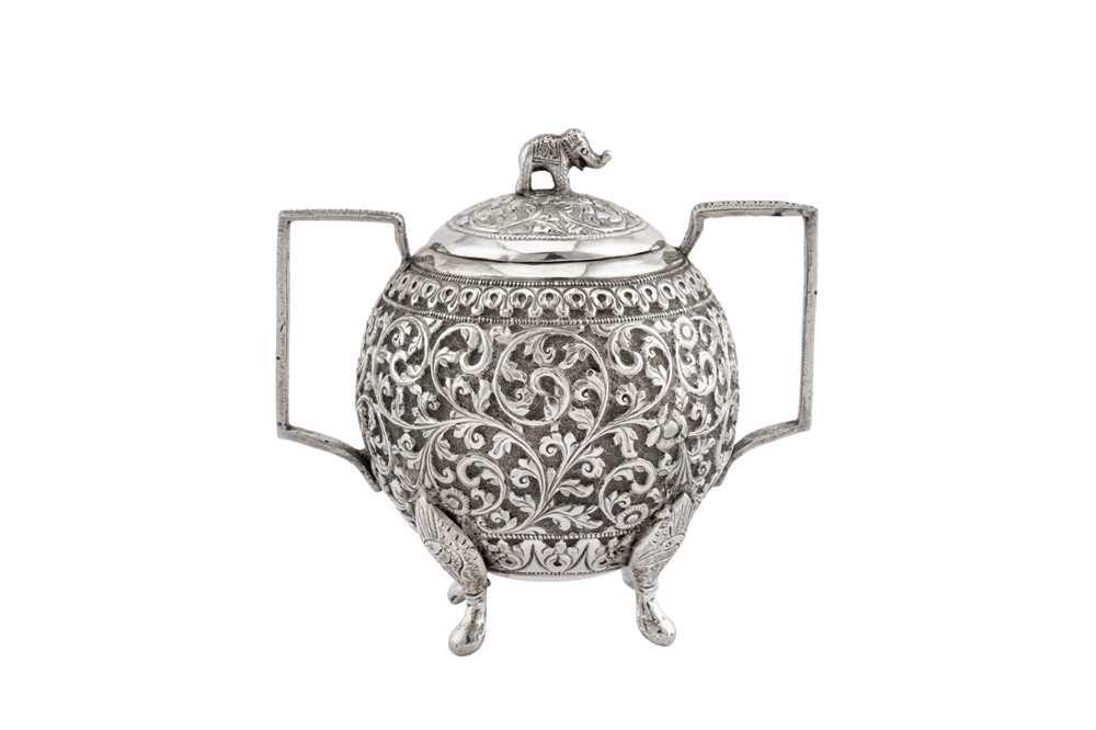 A late 19th century Anglo – Indian unmarked silver covered twin handled sugar bowl, Cutch circa 1890