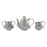 An assembled late 19th / early 20th century Anglo – Indian unmarked silver three-piece tea service,