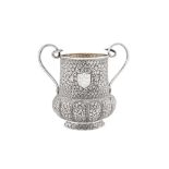 A late 19th century Anglo – Indian unmarked silver twin handled cup, Kashmir dated 1887