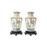 A PAIR OF CHINESE CANTON ENAMEL VASES 民國時期 廣東銅胎畫琺瑯花卉紋瓶一對