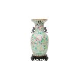 A CHINESE FAMILLE-ROSE VASE 青釉粉彩繪瓶連木座