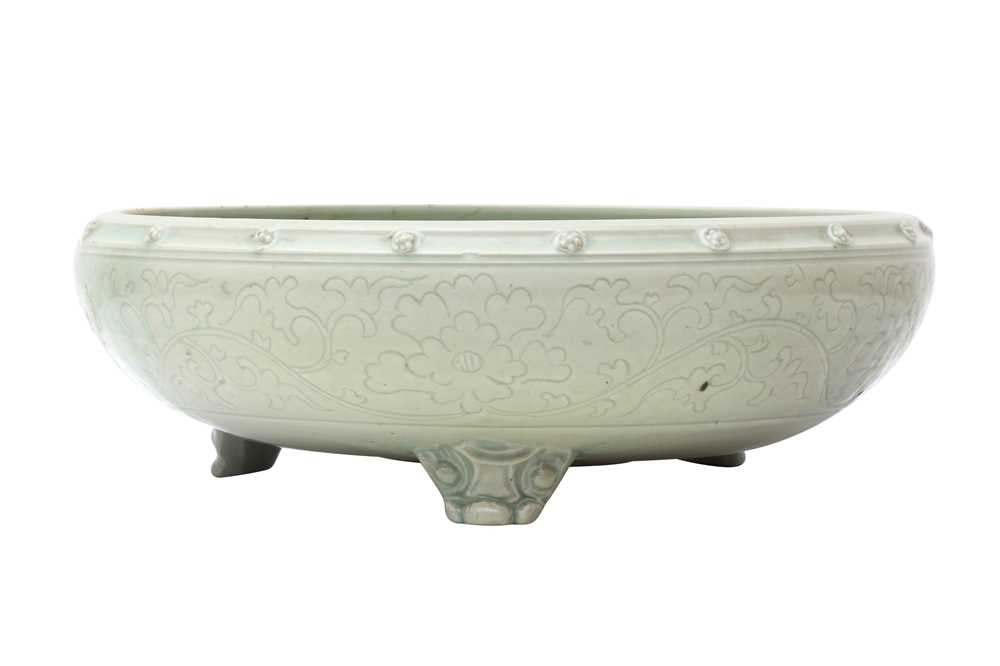 A CHINESE CELADON-GLAZED INCENSE BURNER 晚明 青釉暗刻纏枝紋三足爐