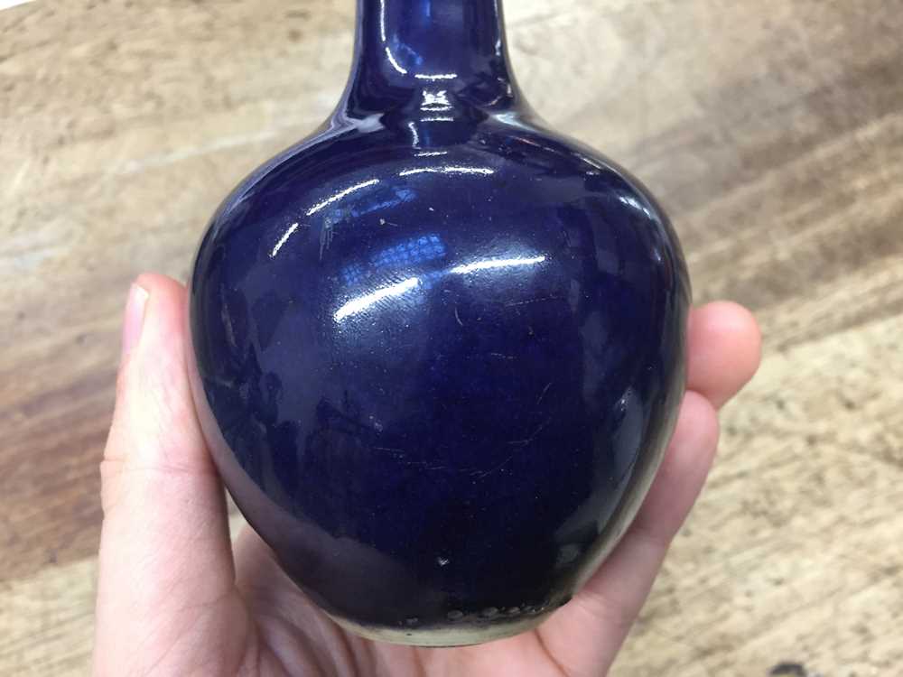 TWO SMALL CHINESE MONOCHROME BLUE-GLAZED VASES 清十八世紀 藍釉長頸撇口瓶及藍釉長頸瓶 - Image 15 of 16