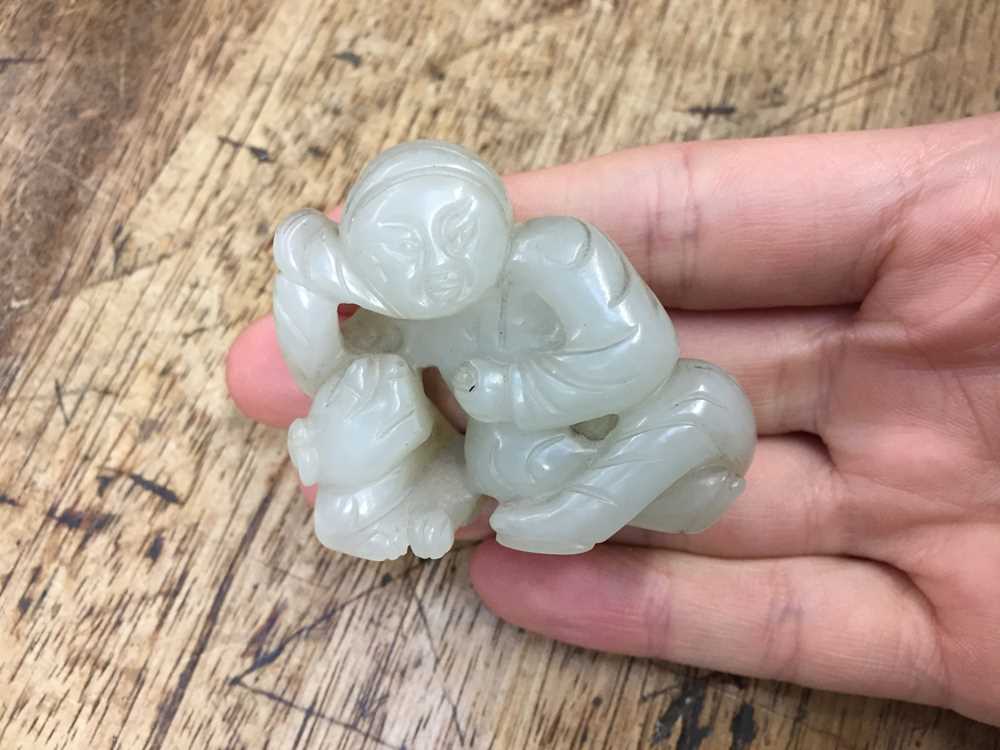 A CHINESE PALE CELADON JADE 'BOY AND DOG' FIGURE 二十世紀 青白玉雕童子戲犬擺件 - Image 3 of 8