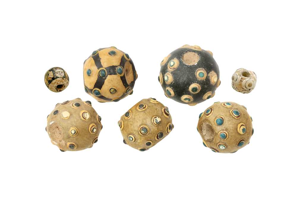 A GROUP OF SEVEN CHINESE GLASS 'EYE' BEADS 東周至漢 蜻蜓眼琉璃珠