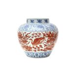 A CHINESE COPPER RED-ENAMELLED BLUE AND WHITE 'LOTUS POND' JAR 或為明 青花紅料蓮池罐