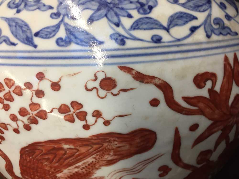 A CHINESE COPPER RED-ENAMELLED BLUE AND WHITE 'LOTUS POND' JAR 或為明 青花紅料蓮池罐 - Image 16 of 23