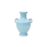 A CHINESE PALE BLUE-GLAZED VASE 天藍釉奎龍紋雙耳瓶 《大清乾隆年製》款