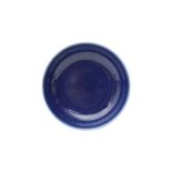 A CHINESE MONOCHROME BLUE-GLAZED DISH 晚清 藍釉盤
