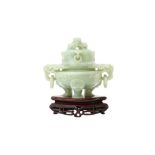 A CHINESE PALE CELADON HARDSTONE 'DRAGON' CENSER AND COVER 二十世紀 青白硬石螭龍紋活耳環三足蓋爐