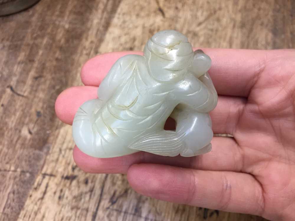 A CHINESE PALE CELADON JADE 'BOY AND DOG' FIGURE 二十世紀 青白玉雕童子戲犬擺件 - Image 4 of 8