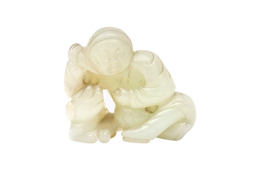 A CHINESE PALE CELADON JADE 'BOY AND DOG' FIGURE 二十世紀 青白玉雕童子戲犬擺件