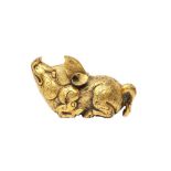 A CHINESE GILT-BRONZE 'PIG' SCROLL WEIGHT 清十九或二十世紀 鎏金銅豬形鎮紙