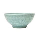 A CHINESE CELADON-GLAZED 'PEONIES' BOWL 青釉牡丹紋盌