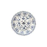 A CHINESE BLUE AND WHITE 'FOLIATE SCROLL' DISH 十九世紀或後期 青花纏枝花紋盤