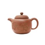 A CHINESE YIXING ZISHA TEAPOT AND COVER 二十世紀 宜興紫砂茶壺連蓋