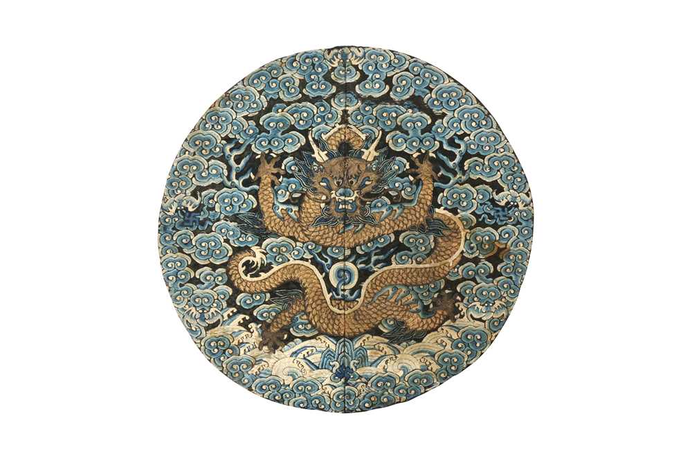 A CHINESE SILK EMBROIDERED MIDNIGHT-BLUE 'DRAGON' ROUNDEL, BUZI 清咸豐 絲繡龍紋補子