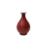 A CHINESE COPPER RED-GLAZED VASE, YUHUCHUNPING 紅釉玉壺春瓶