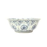 A CHINESE BLUE AND WHITE FOLIATE PUNCH BOWL 明 青花穿花龍紋大盌 《大明年製》款