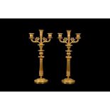 A FINE PAIR OF EARLY 19TH CENTURY FRENCH EMPIRE PERIOD GILT-BRONZE CANDELABRA