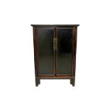 A CHINESE BLACK LACQUERED PINE CABINET, EARLY 20TH CENTURY