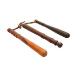 A GROUP OF THREE WOODEN POLICE TRUNCHEONS