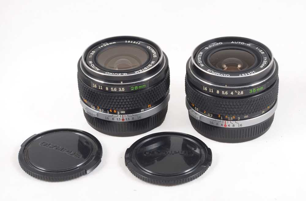 A Pair of Olympus M-System "Silver Nose" Wide Angle Lenses.
