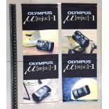 A Pair of Large Hanging Banners Advertising Olympus MJU Compact Cameras.