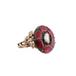 An antique garnet and pearl ring