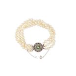 A multi-strand cultured pearl, emerald and diamond bracelet