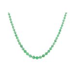 A jade necklace with a diamond clasp