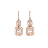 A pair of diamond pendent earrings