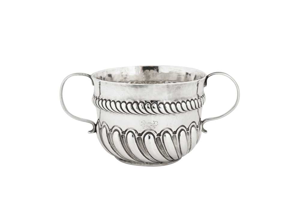 A William and Mary sterling silver twin handled caudle cup, London 1691 by I.N in an oval