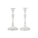 A pair of Victorian sterling silver candlesticks, London 1899 by Holland, Aldwinckle and Slater