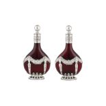 A pair of late 19th century German 800 standard silver mounded ruby glass decanters, Kesselstadt cir