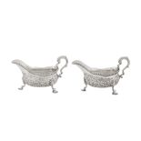 A pair of George III sterling silver sauce boats, London 1766 by Thomas Heming