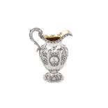 A large George IV sterling silver milk jug, London 1828 by messrs Barnard